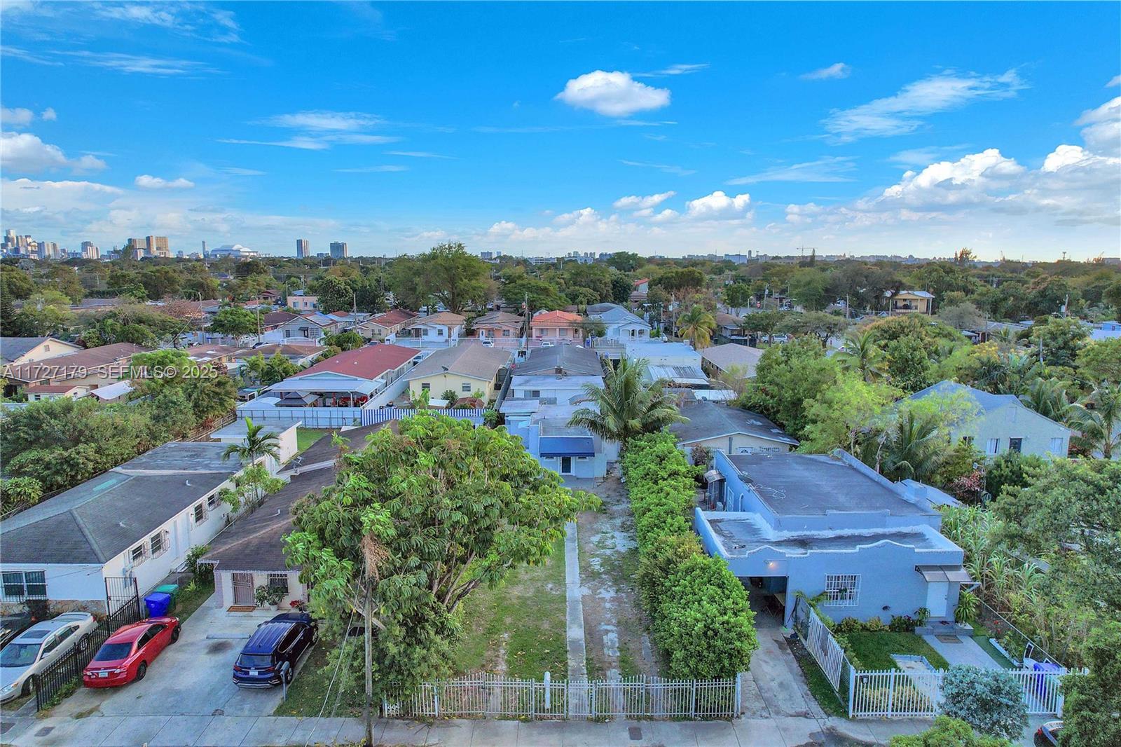 2372 Northwest 34th Street Miami, FL 33142 - Photo 25 of 50 an aerial view of a houses with a yard