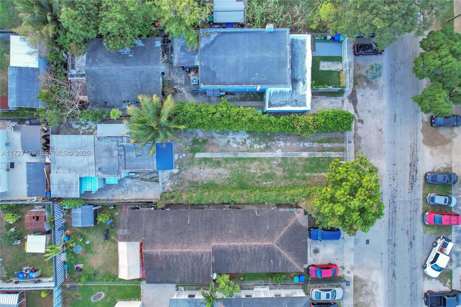 2372 Northwest 34th Street Miami, FL 33142 - Photo 34 of 50 a aerial view of a house with a yard and a fountain