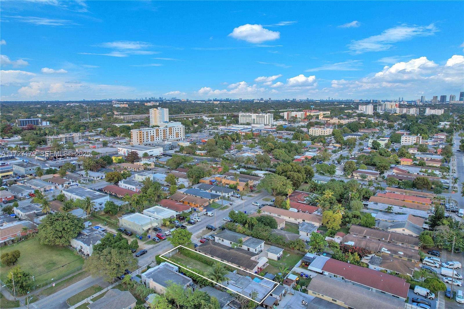2372 Northwest 34th Street Miami, FL 33142 - Photo 39 of 50 an aerial view of residential houses with city view