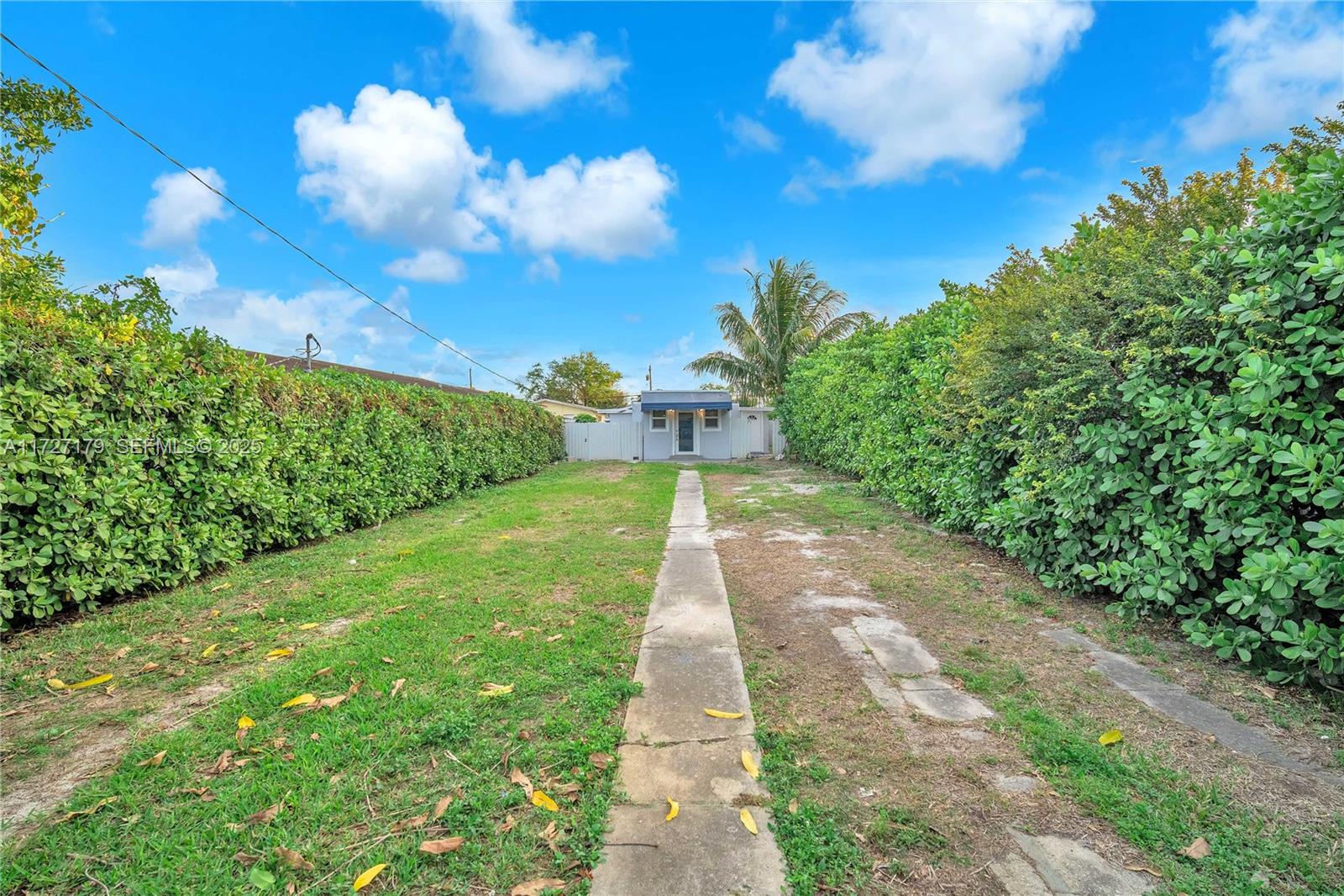2372 Northwest 34th Street Miami, FL 33142 - Photo 43 of 50 a view of a pathway with a big yard