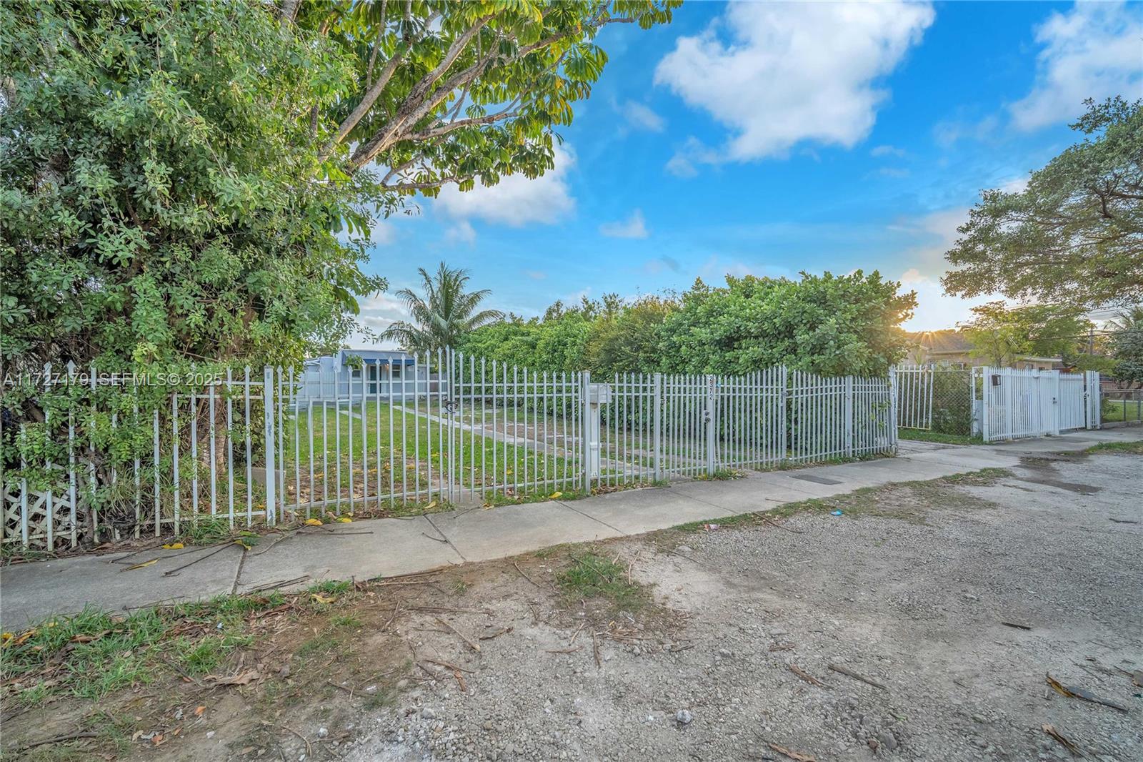 2372 Northwest 34th Street Miami, FL 33142 - Photo 45 of 50 a view of a fence with a small yard