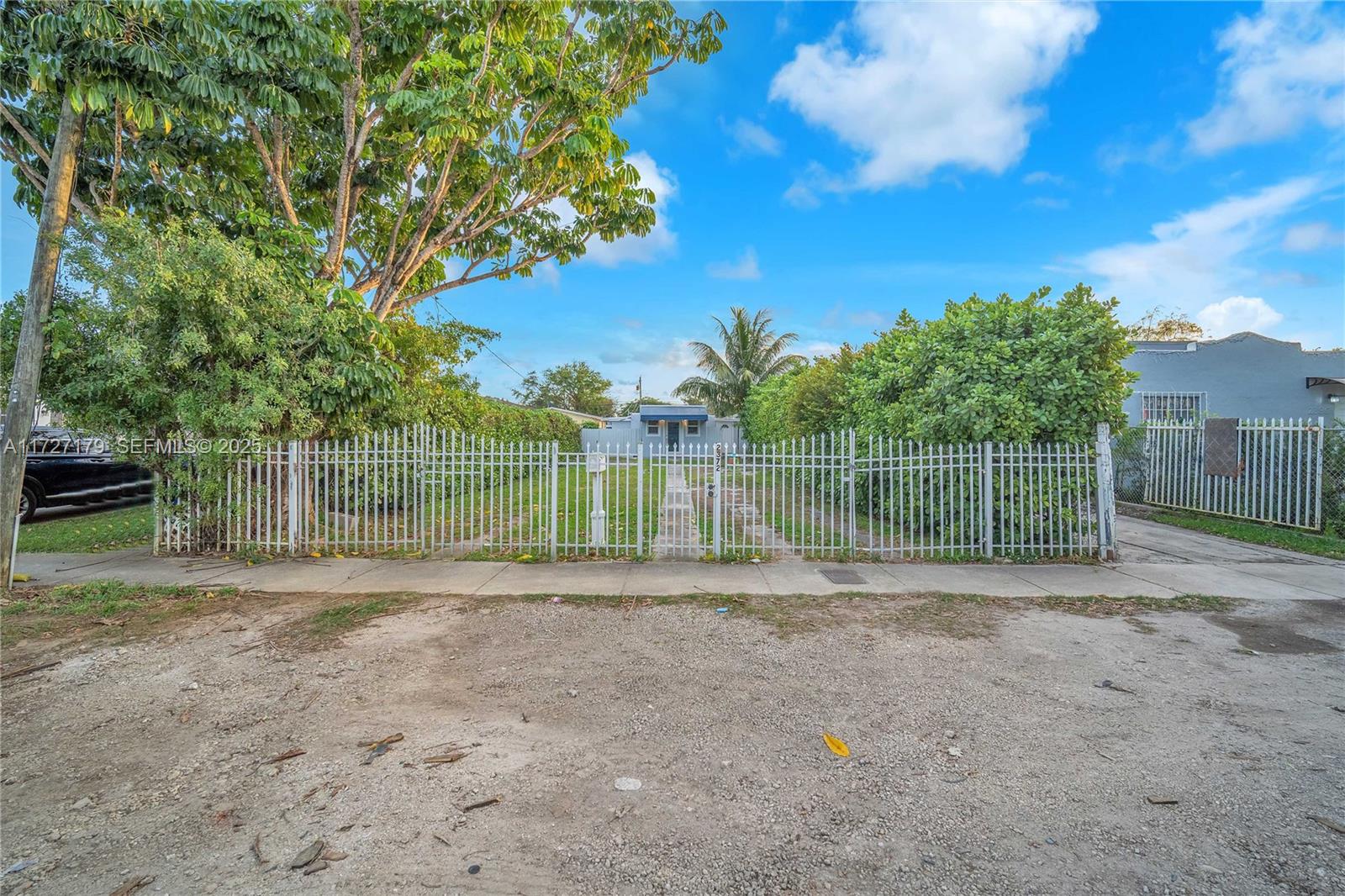 2372 Northwest 34th Street Miami, FL 33142 - Photo 46 of 50 a view of a yard with wooden fence
