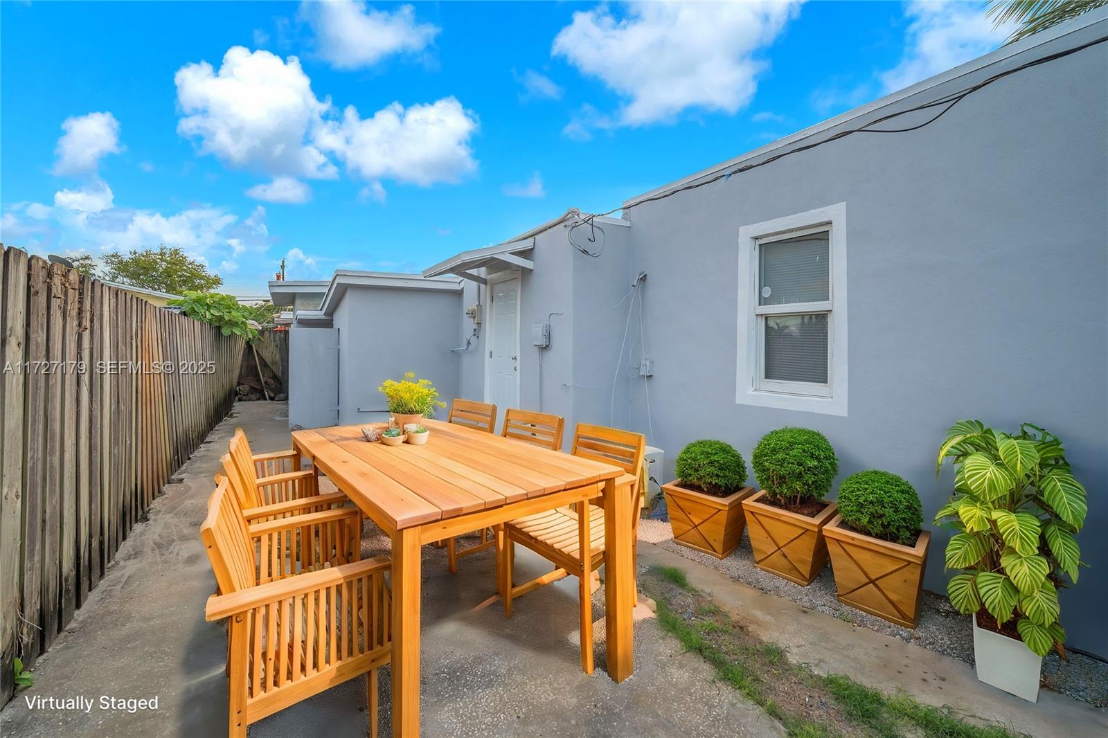 2372 Northwest 34th Street Miami, FL 33142 - Photo 7 of 50 a terrace with table and chairs