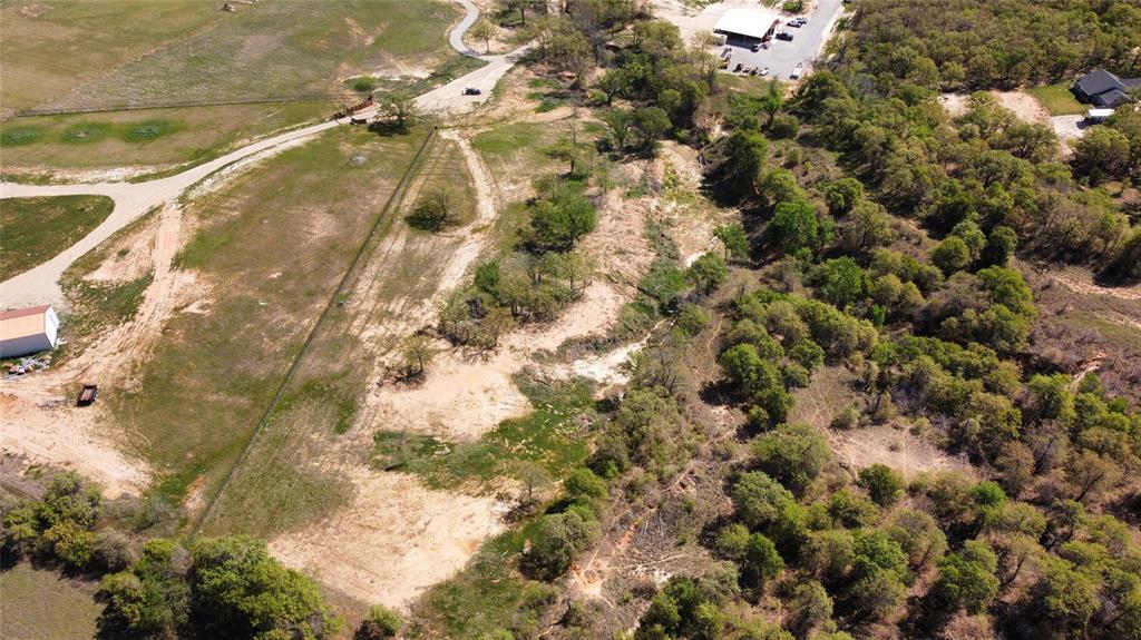 1031 Akin Road Poolville, TX 76487 - Photo 9 of 9 a aerial view of a residential houses with yard