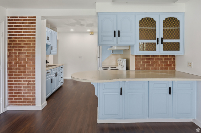774 37th Street South Ogden, UT 84403 - Photo 9 of 47 Kitchen area featuring light blue cabinetry with dark hardware and a curved peninsula countertop