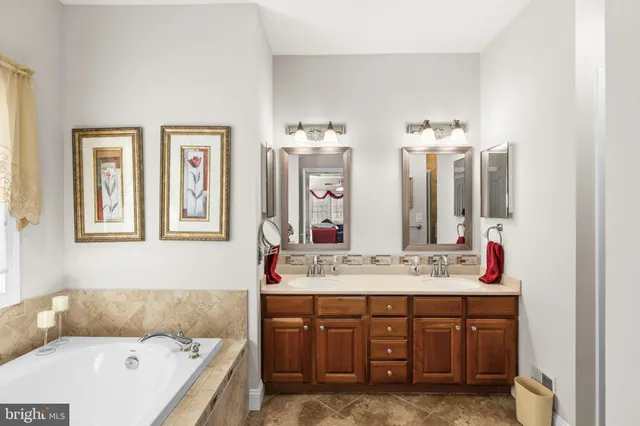 a bed room with a bed and a chair