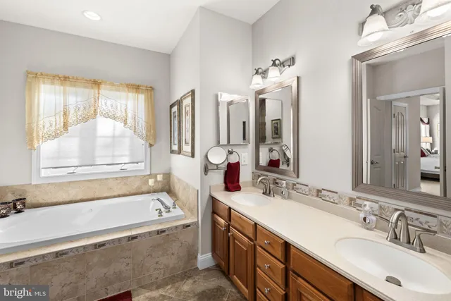 a bedroom with a large bed and a desk