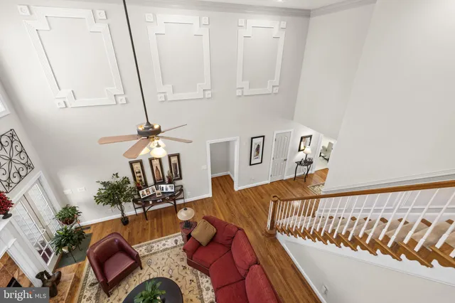 a kitchen with stainless steel appliances granite countertop a sink a stove and chairs