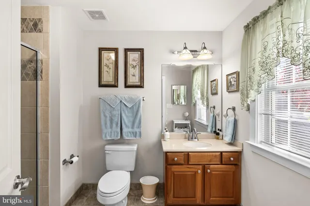 a balcony with table and chairs