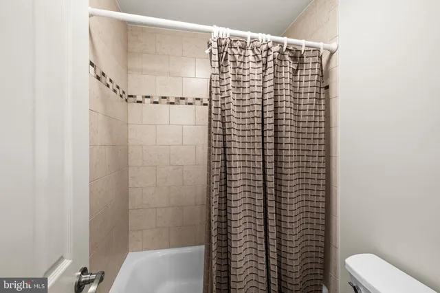 a view of a lake with a house in the background