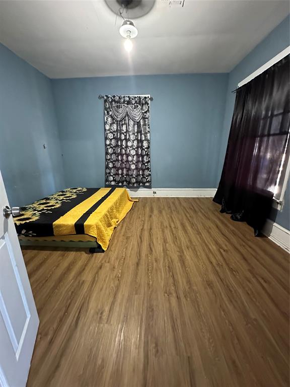 1824 Lyle Avenue Waco, TX 76708 - Photo 12 of 13 Bedroom with wood finished floors