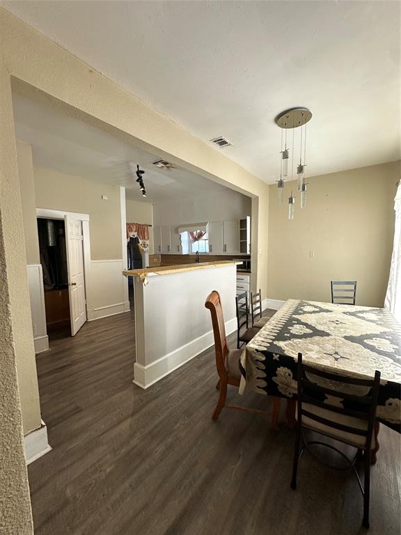 1824 Lyle Avenue Waco, TX 76708 - Photo 8 of 13 Dining space with dark wood-style flooring