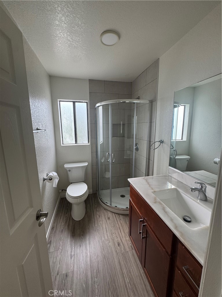 216 Sheldon Street, Unit 1 El Segundo, CA 90245 - Photo 12 of 16 a bathroom with a sink toilet a mirror and shower
