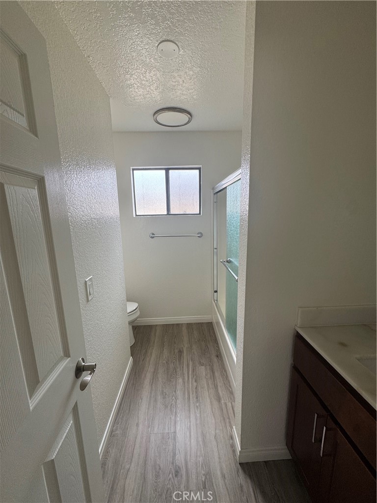 216 Sheldon Street, Unit 1 El Segundo, CA 90245 - Photo 15 of 16 wooden floor in an empty room with a window