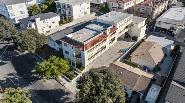 an aerial view of a house with a yard