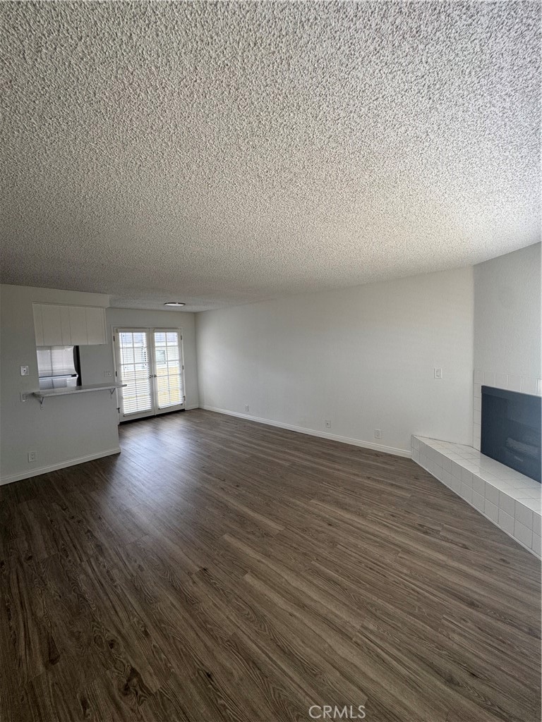 216 Sheldon Street, Unit 1 El Segundo, CA 90245 - Photo 6 of 16 a view of empty room with wooden floor and fan