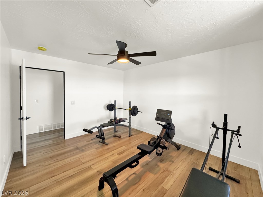 9393 North 93rd Highway Caliente, NV 89008 - Photo 21 of 41 Fitness enthusiasts will appreciate this dedicated exercise space with durable wood flooring and ceiling fan.