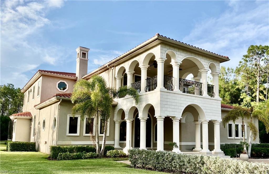 Undisclosed Address Naples, FL 34109 - Photo 2 of 33 a front view of a multi story residential apartment building
