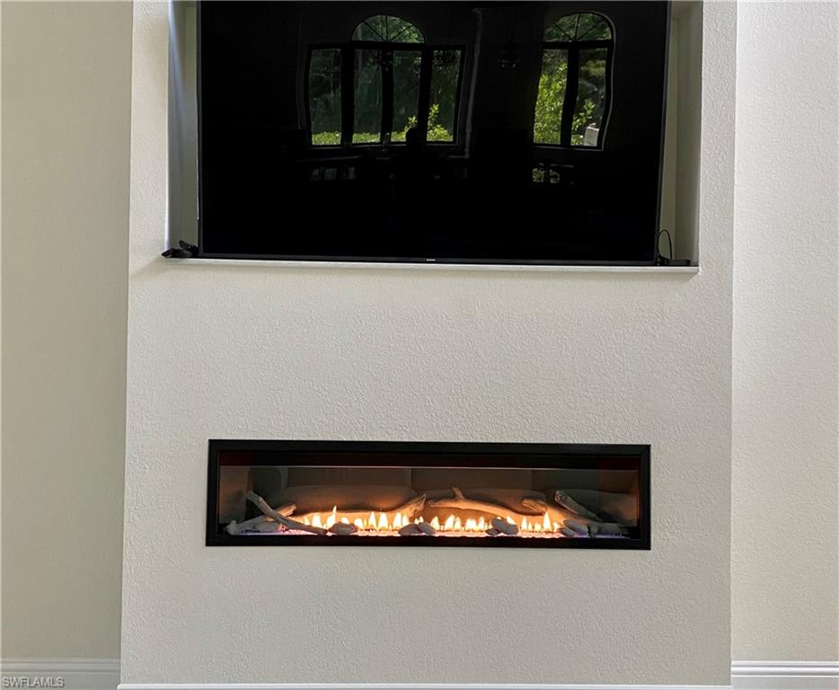 Undisclosed Address Naples, FL 34109 - Photo 13 of 33 a bathroom with a sink and a mirror