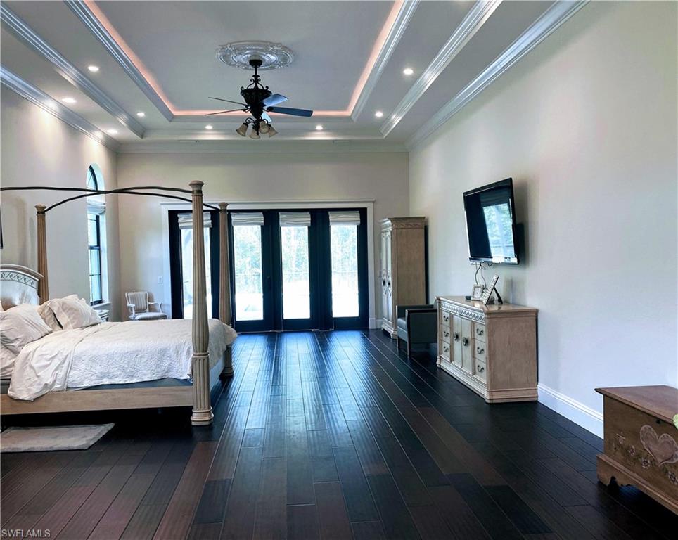 Undisclosed Address Naples, FL 34109 - Photo 15 of 33 a bedroom with bed and wooden floor