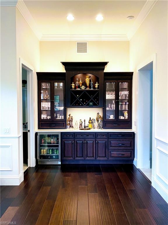 Undisclosed Address Naples, FL 34109 - Photo 19 of 33 a room with furniture and wooden floor