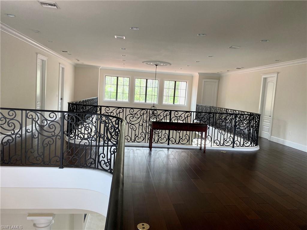 Undisclosed Address Naples, FL 34109 - Photo 24 of 33 a view of an entryway with wooden floor