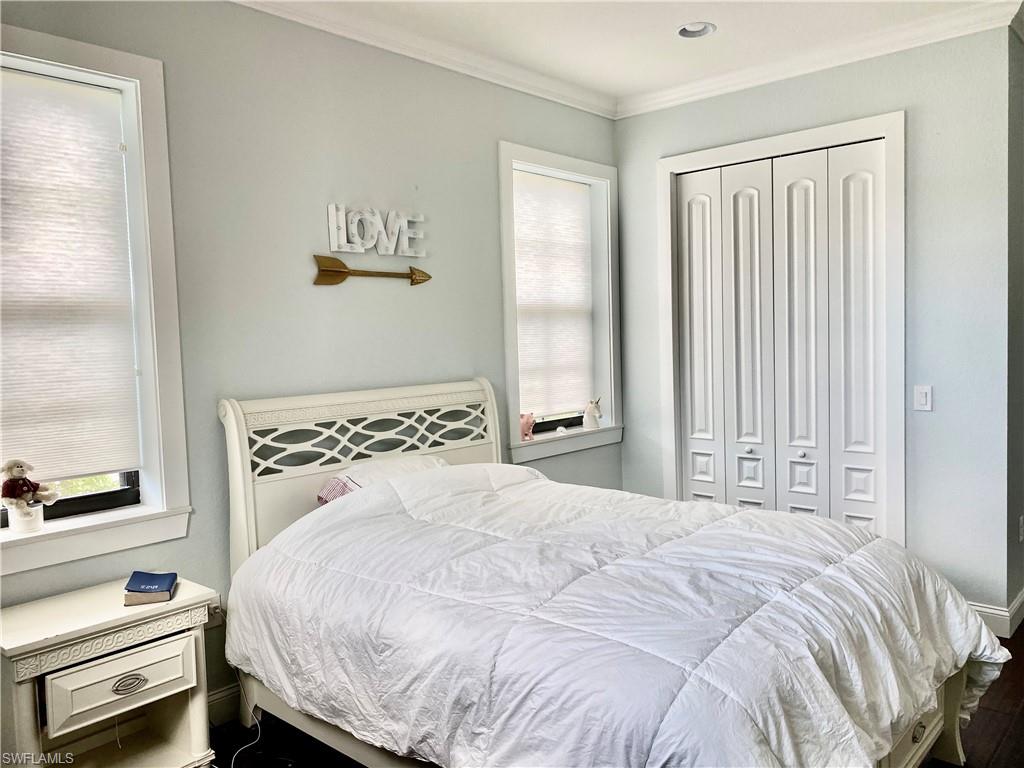 Undisclosed Address Naples, FL 34109 - Photo 28 of 33 a bedroom with a bed and a window