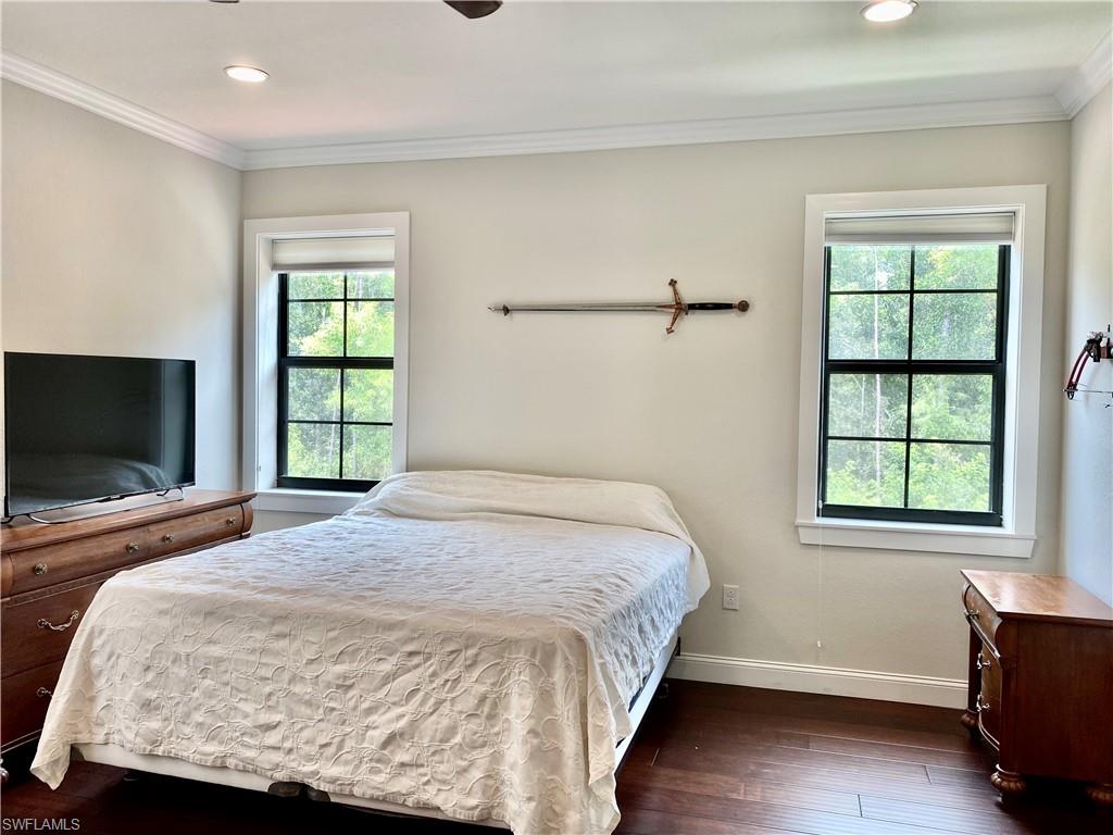 Undisclosed Address Naples, FL 34109 - Photo 30 of 33 a bedroom with a bed and a window