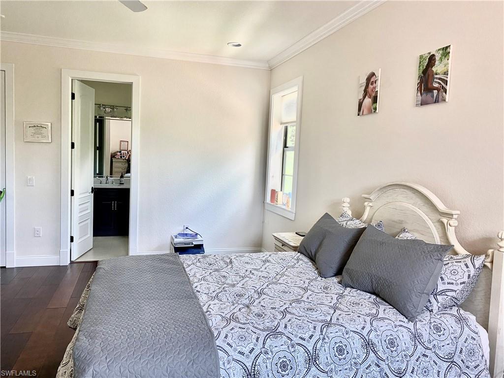 Undisclosed Address Naples, FL 34109 - Photo 32 of 33 a bedroom with a bed and a couch