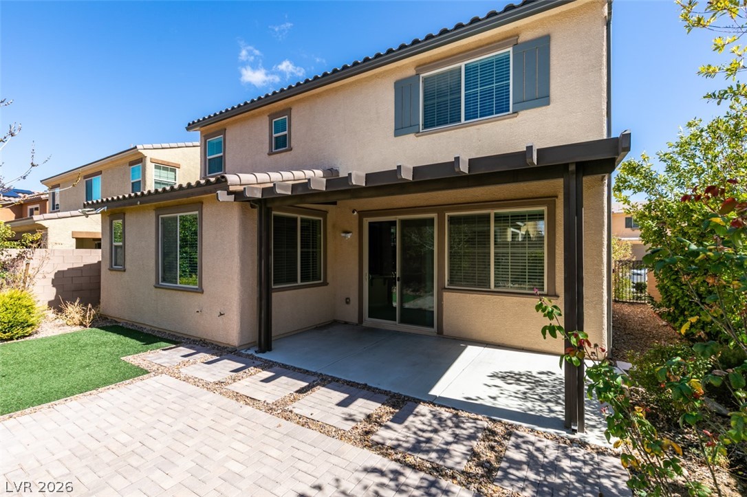 2549 Sable Ridge Street Henderson, NV 89044 - Photo 6 of 8 A spacious backyard features a covered patio with direct access to the home, ideal for outdoor leisure.