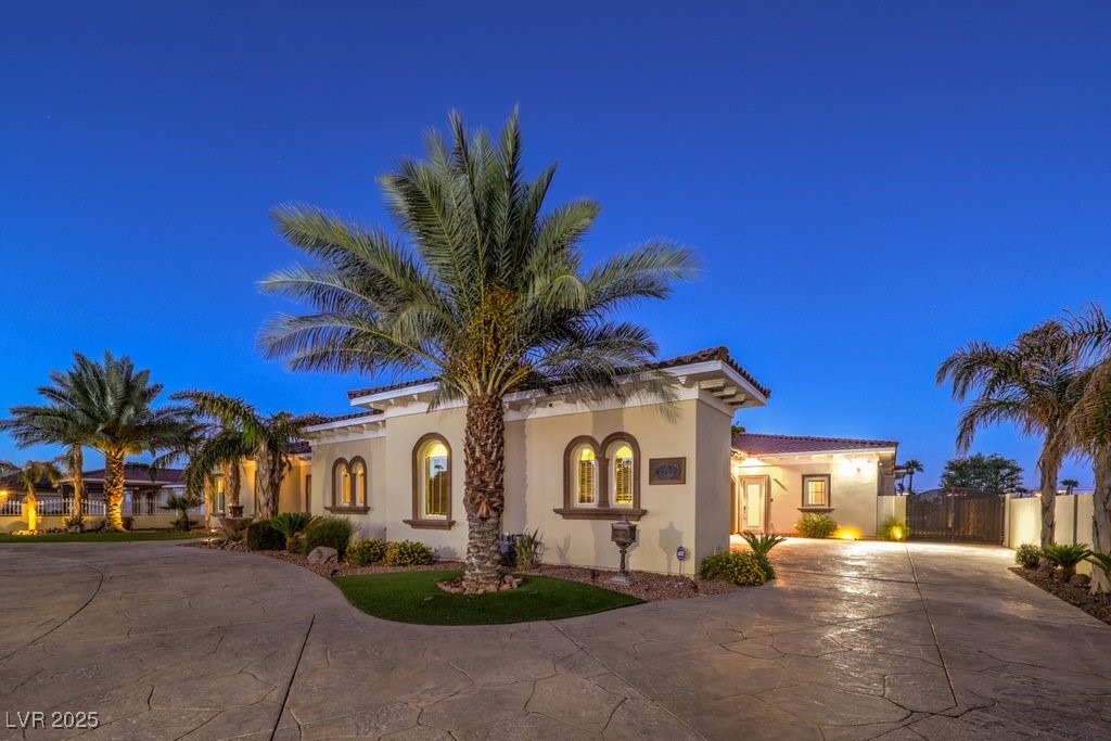 2780 El Camino Road Las Vegas, NV 89146 - Photo 3 of 90 Mediterranean / spanish-style house with fence, curved driveway, and stucco siding