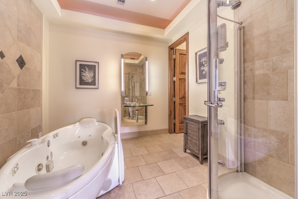 2780 El Camino Road Las Vegas, NV 89146 - Photo 48 of 90 Bathroom with tile patterned flooring, a stall shower, and a tub with jets