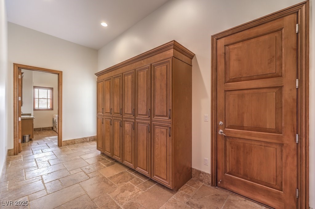 2780 El Camino Road Las Vegas, NV 89146 - Photo 62 of 90 Hallway with stone tile flooring, recessed lighting, and baseboards