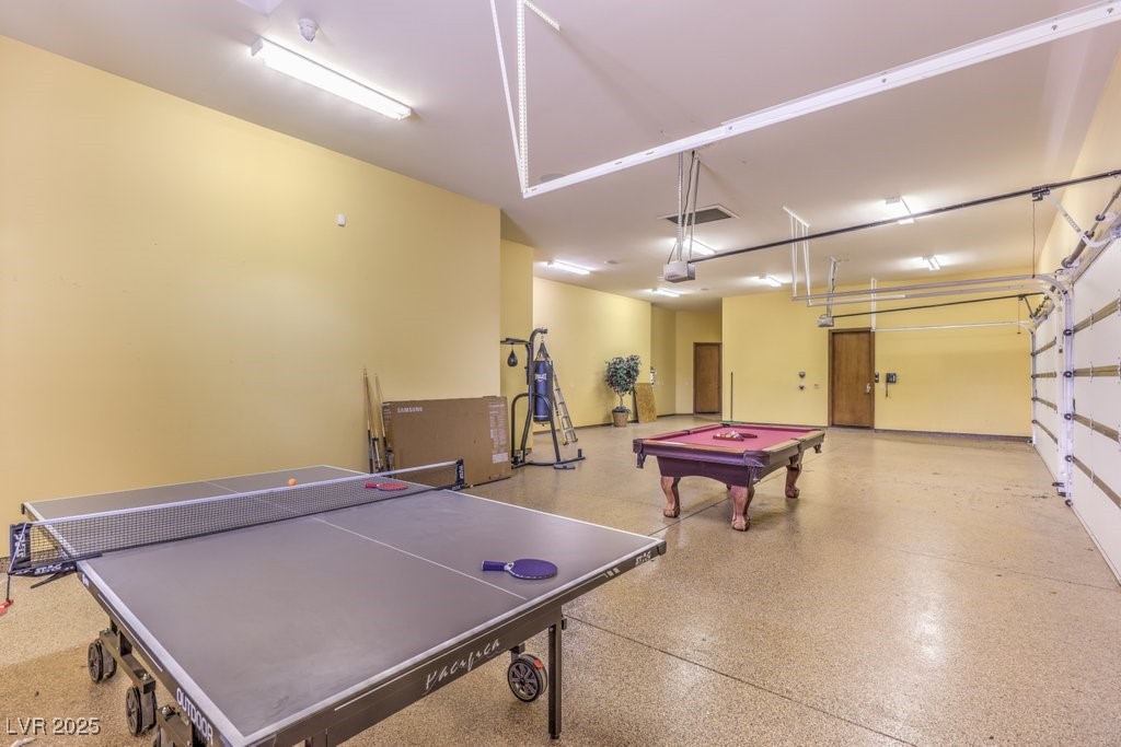 2780 El Camino Road Las Vegas, NV 89146 - Photo 64 of 90 Playroom featuring billiards, visible vents, speckled floor, and a garage