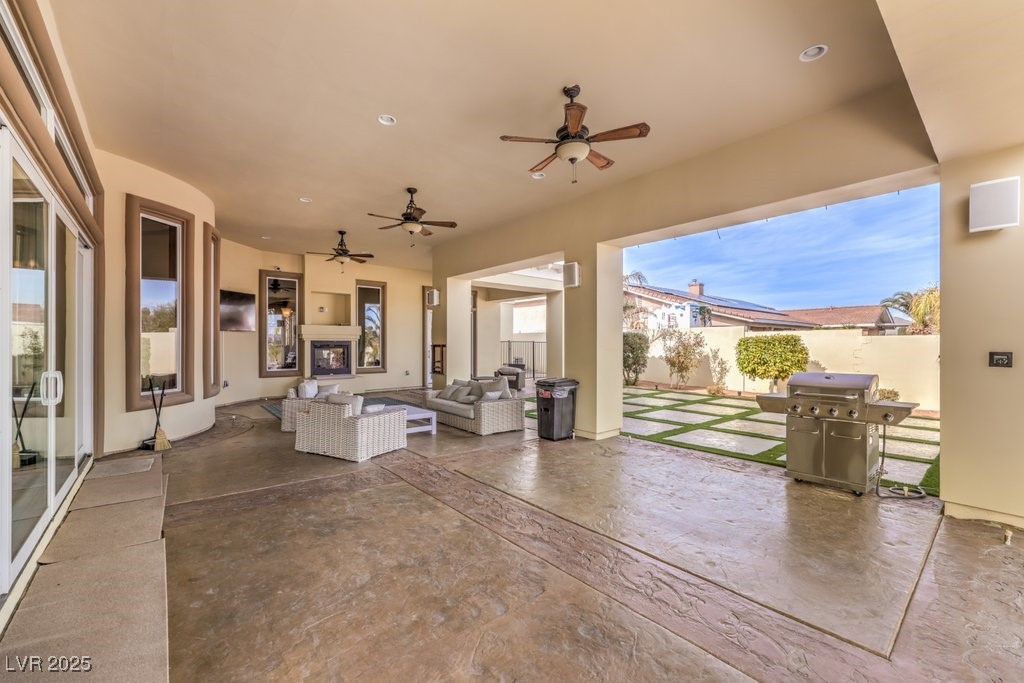 2780 El Camino Road Las Vegas, NV 89146 - Photo 66 of 90 View of patio / terrace featuring area for grilling, ceiling fan, fence, and outdoor lounge area