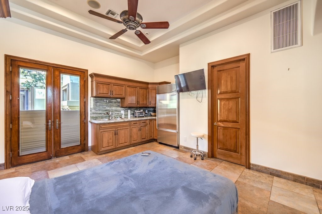 2780 El Camino Road Las Vegas, NV 89146 - Photo 72 of 90 Kitchen featuring french doors, visible vents, stainless steel built in refrigerator, and tasteful backsplash