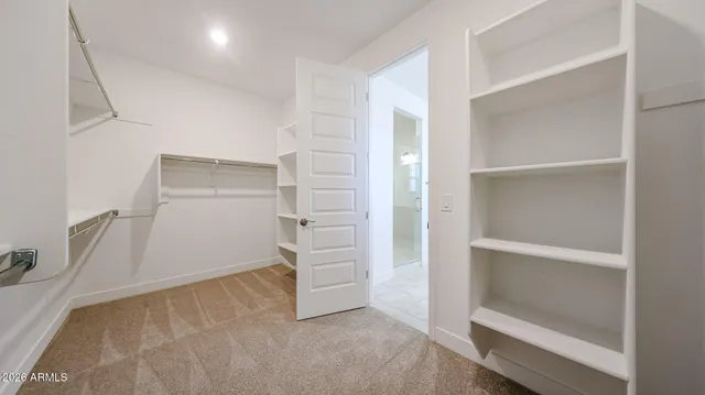 a view of an empty walk in closet