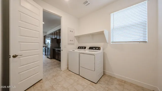 a utility room with washer and dryer