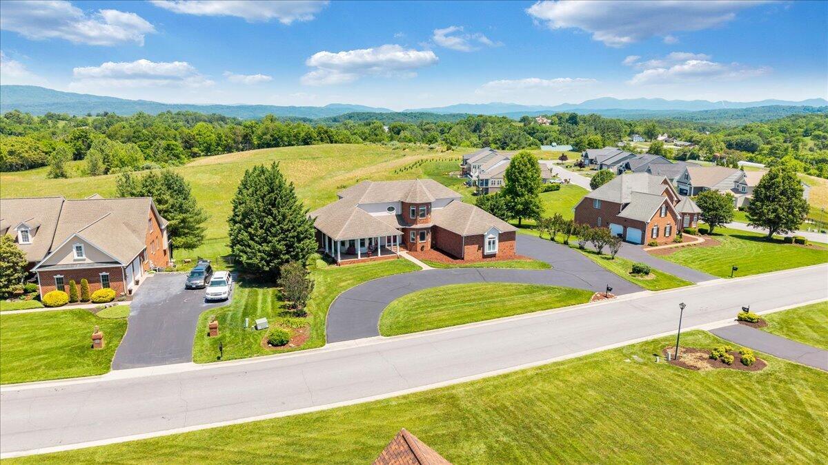 625 Frontier Way Fincastle, VA 24090 - Photo 95 of 105 an aerial view of a house with a garden and lake view