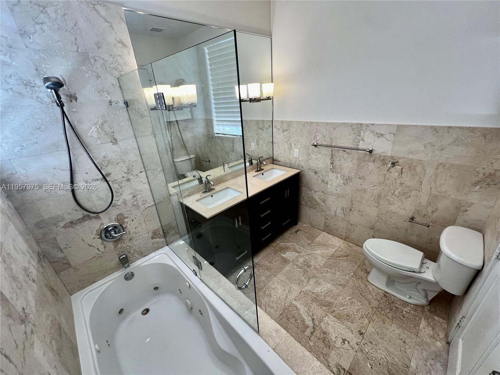 2301 Southwest 22nd Avenue Miami, FL 33145 - Photo 14 of 24 a bathroom with a sink toilet and shower