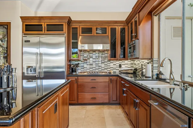 a bedroom with a bed and large window