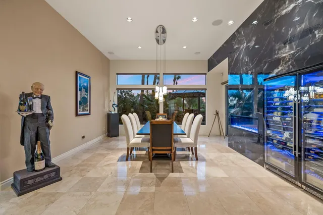 a front view of a house with a yard table and chairs