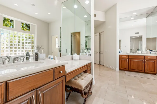 an aerial view of a house with a yard and outdoor seating