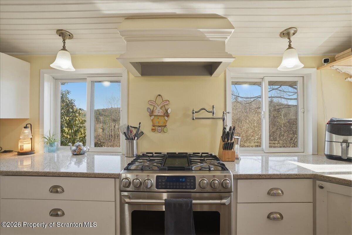 519 Sutton Road New Milford, PA 18834 - Photo 15 of 80 a stove top oven sitting inside of a kitchen