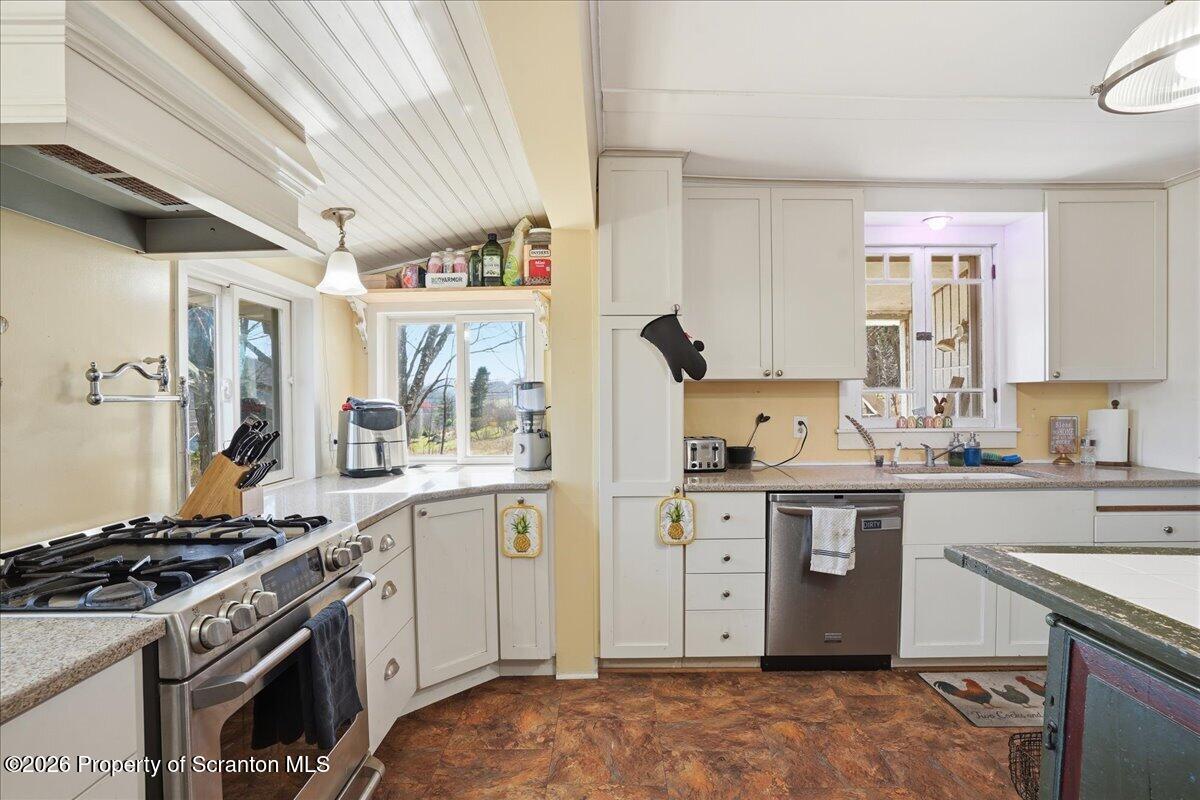 519 Sutton Road New Milford, PA 18834 - Photo 16 of 80 a kitchen with a stove and a sink