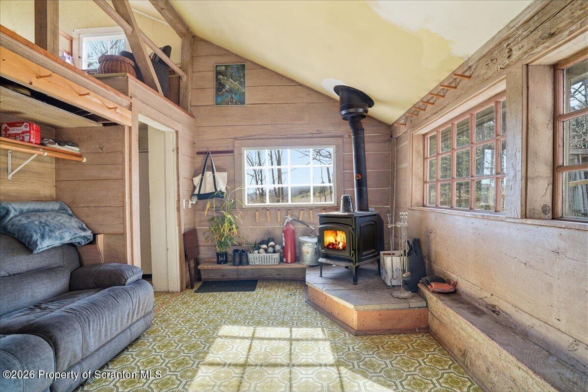 519 Sutton Road New Milford, PA 18834 - Photo 21 of 80 a living room with furniture and a flat screen tv