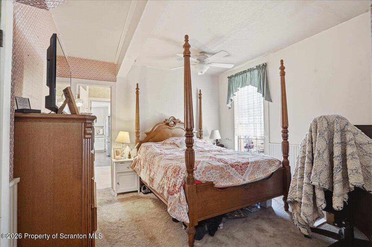 519 Sutton Road New Milford, PA 18834 - Photo 22 of 80 a bed room with a bed window and a mirror