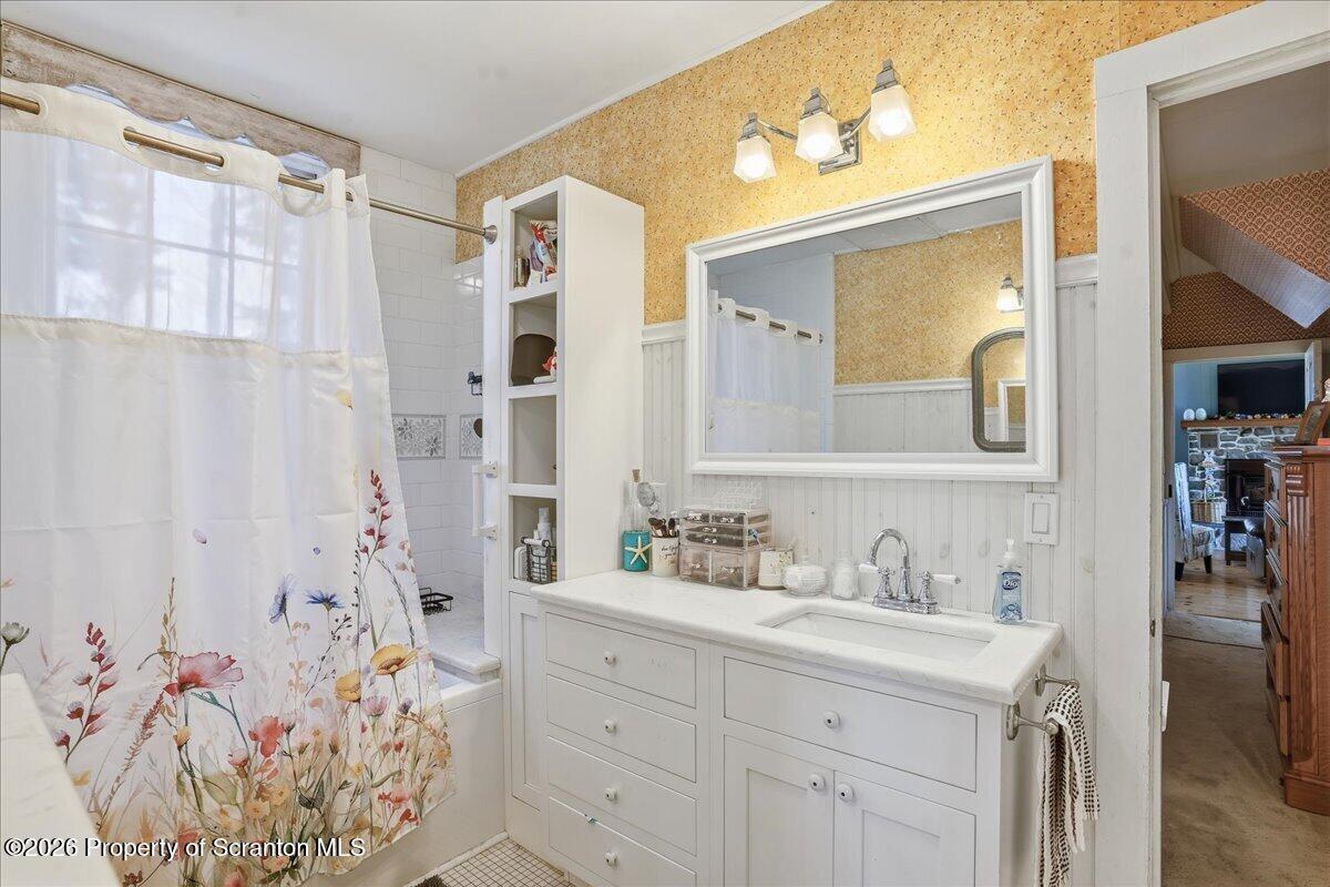 519 Sutton Road New Milford, PA 18834 - Photo 24 of 80 a bathroom with a sink vanity and a mirror