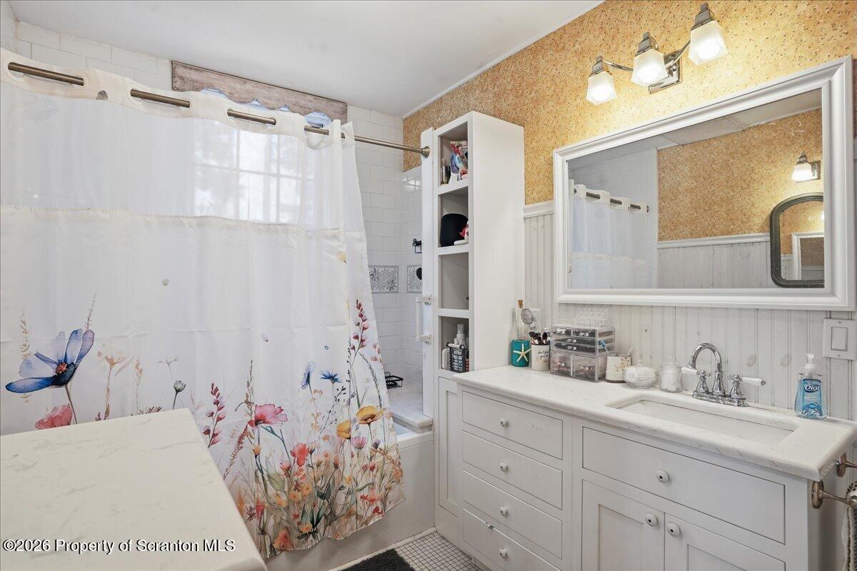 519 Sutton Road New Milford, PA 18834 - Photo 25 of 80 a bathroom with a tub sink and mirror