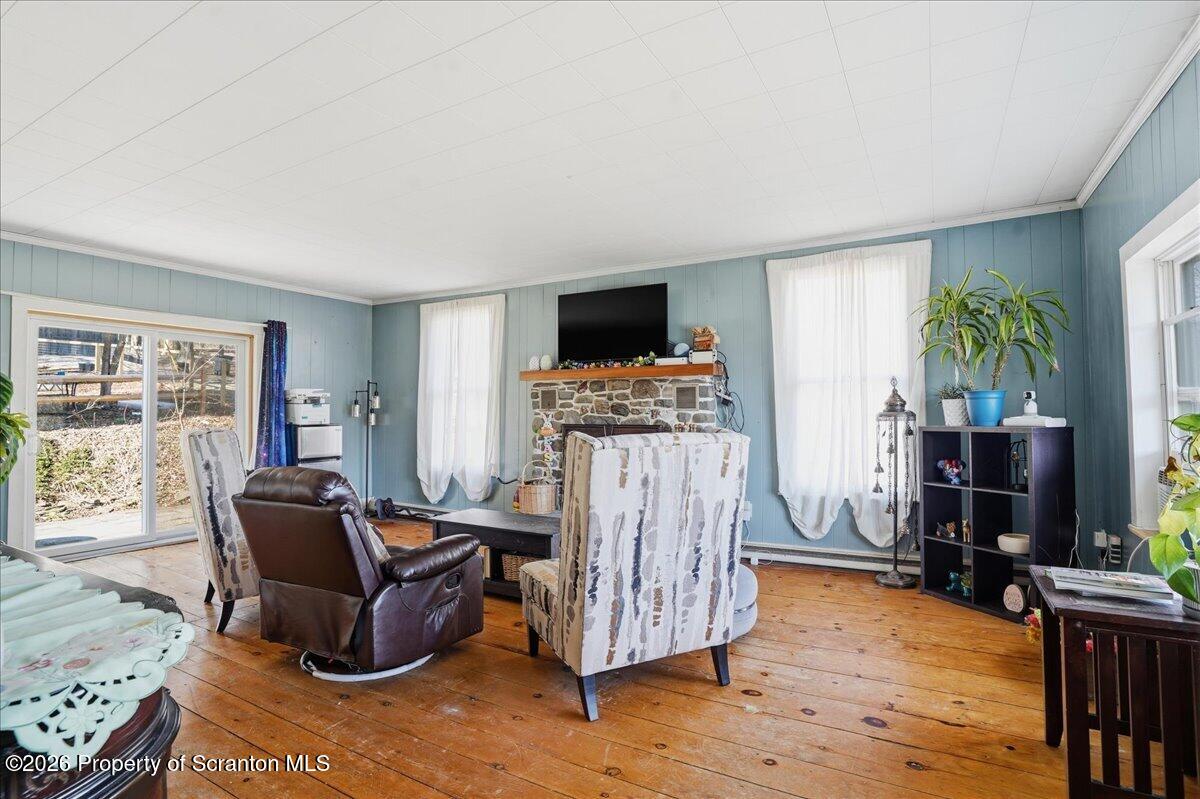 519 Sutton Road New Milford, PA 18834 - Photo 26 of 80 a living room with furniture and a flat screen tv
